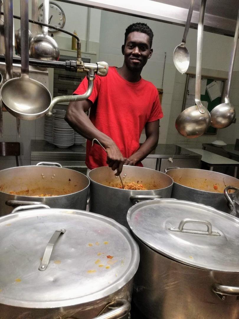 At the three pots in the camp kitchen