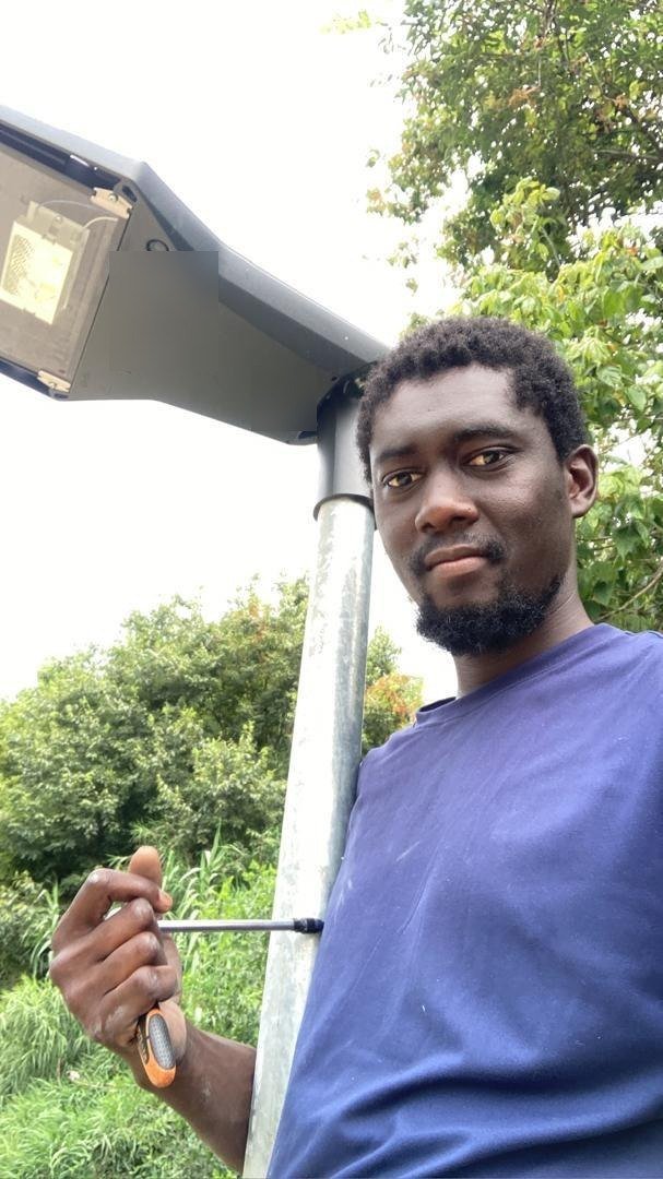 Working on a street lamp